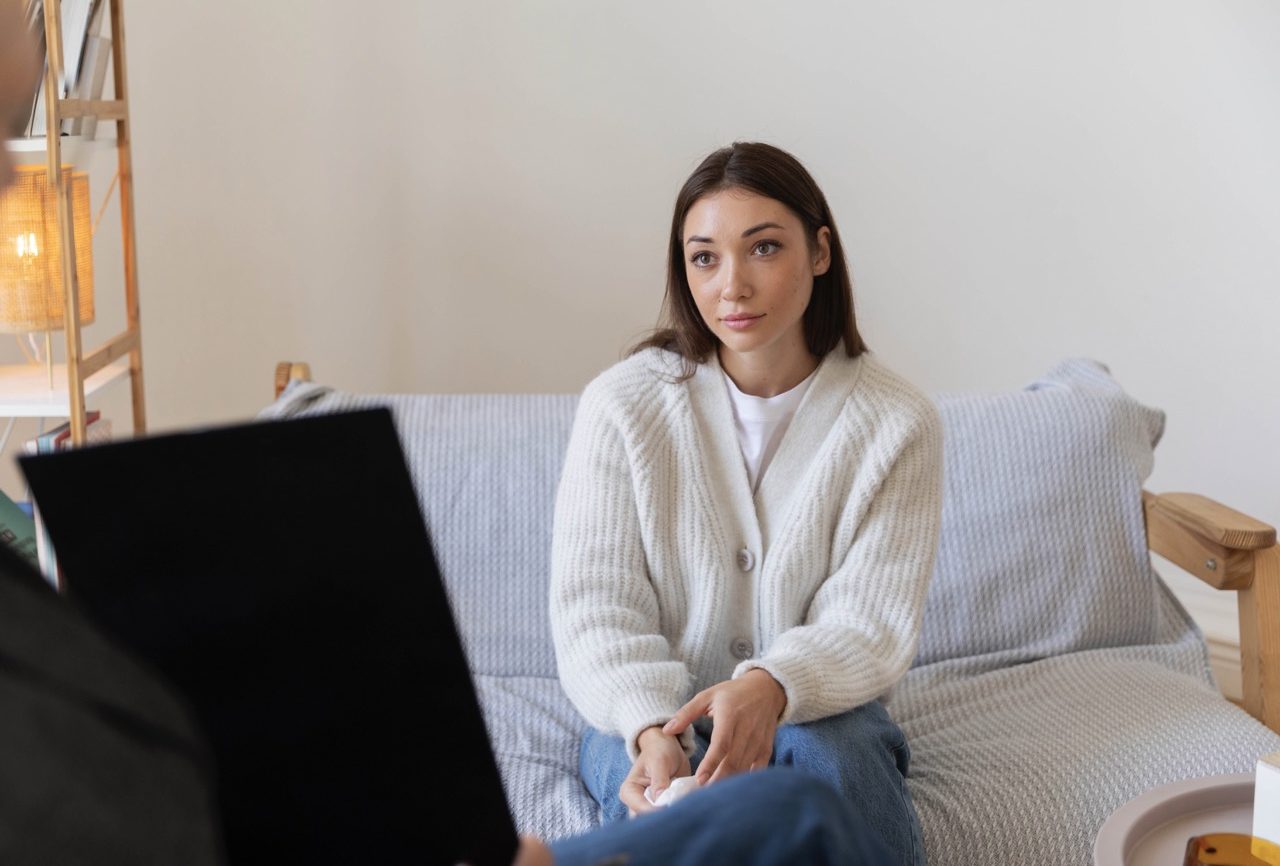 Young woman in therapy session talking with psychologist Dr. Celeste Jones PsyD